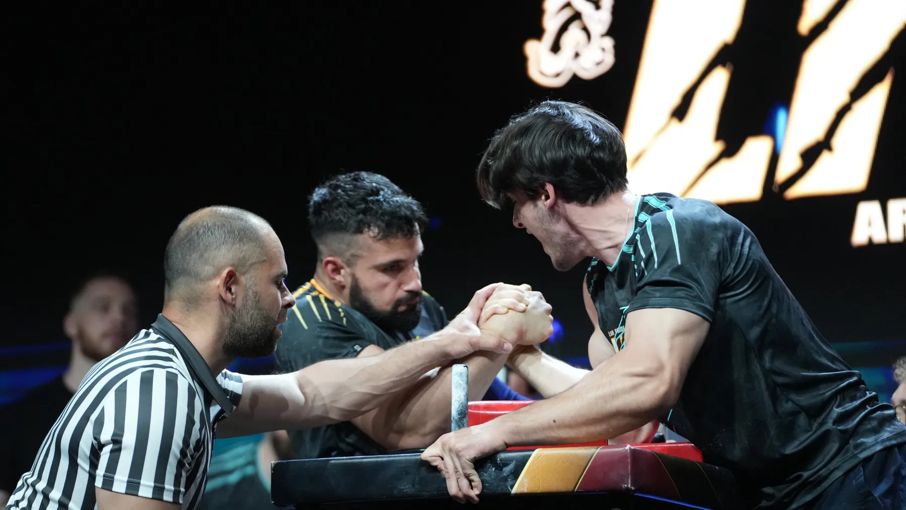 Ethan setting the grip with the referee