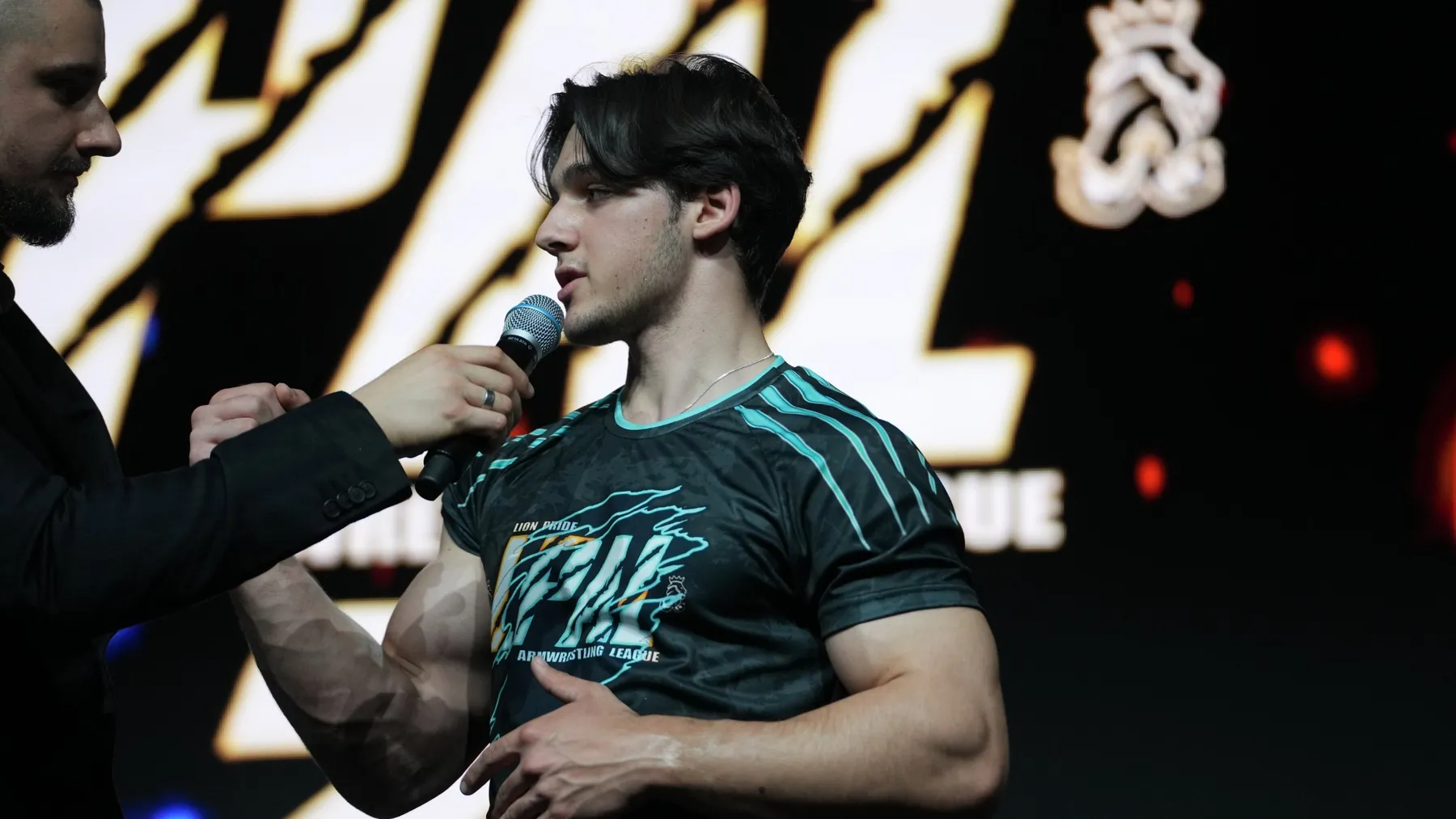 Ethan speaking on stage at LPAL 2