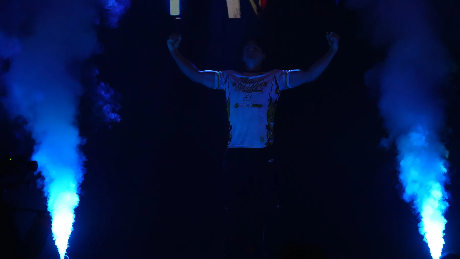 Ethan's walkout at LPAL 3, arms raised in blue light