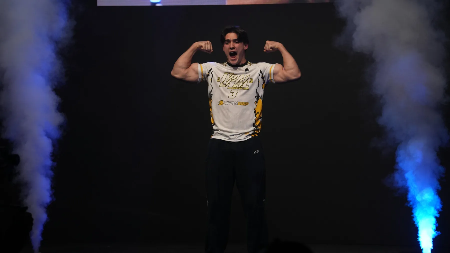 Ethan flexing on stage